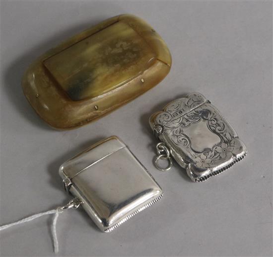 Two silver vesta cases and a 19th century horn snuff box.